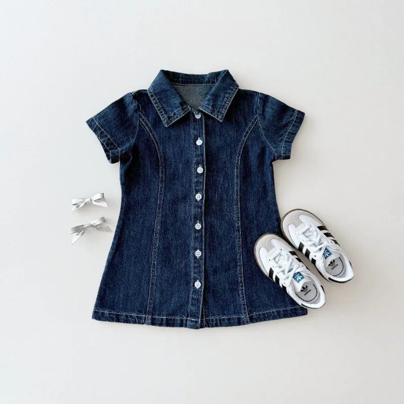 Blue denim dress with white sneakers on a light gray background